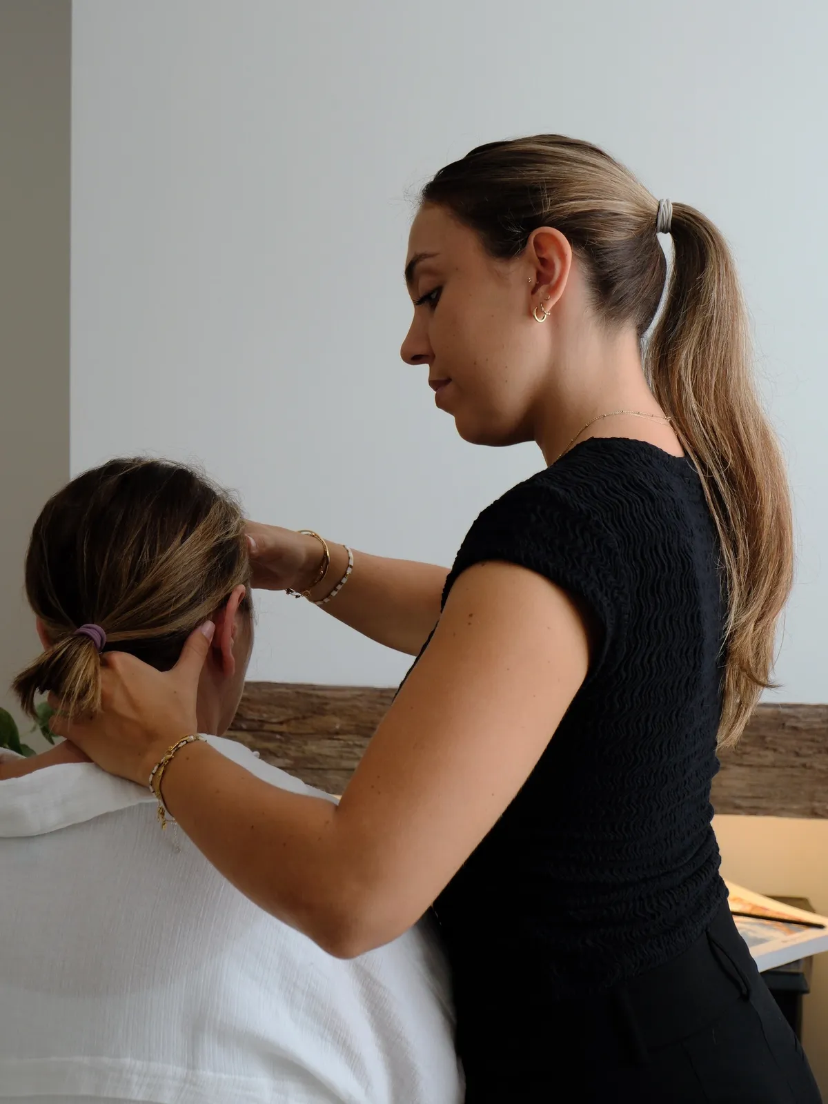 Dr Adriana performing a gentle neck mobilisation